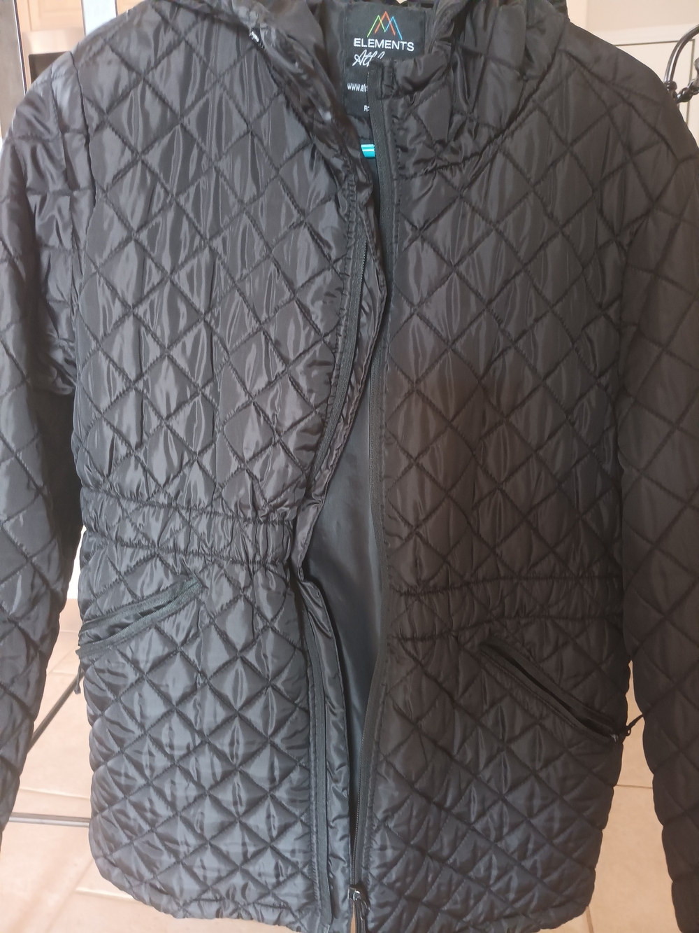 It's a small XL; it fits like a MediumElement Black Quilted Hooded Puffer Jacket